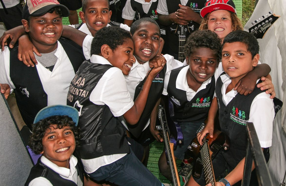 ee485fccb681d9714d1bbaff857a981f (1) Image of a group of students carrying instruments to play music they learned as part of the Australian curriculum