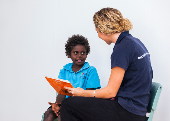effective-teaching-techniques-image-3 Image of teacher reading to a student implementing effective teaching strategies