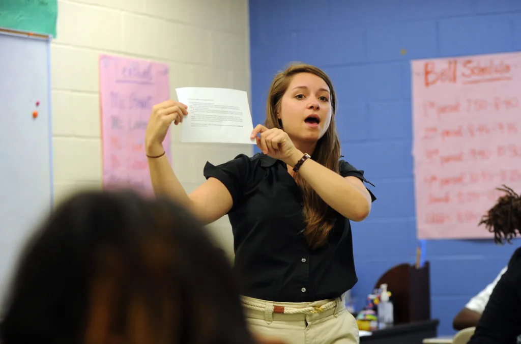 A teacher exemplifying one of the 10 essential classroom management skills as her class is focused and organised.