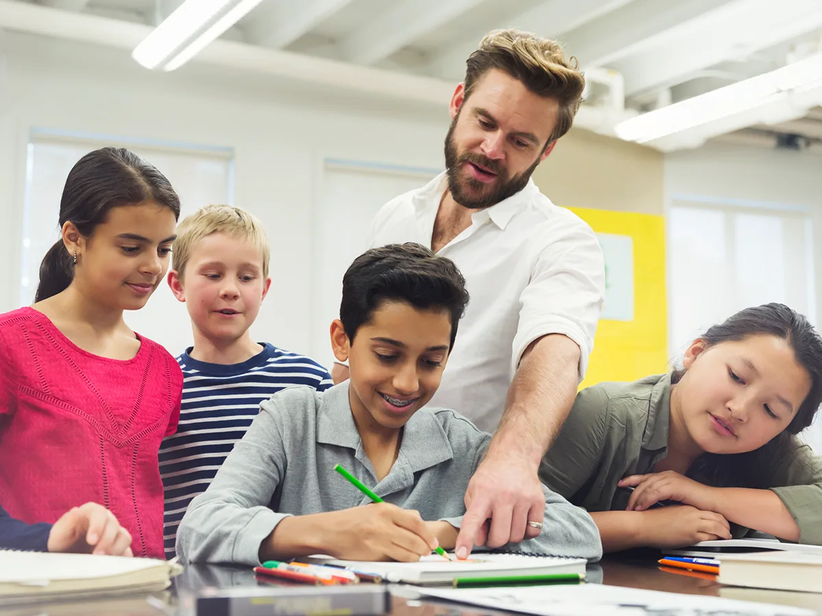 A teacher exemplifying one of the 10 essential classroom management skills as her class is focused and organised.