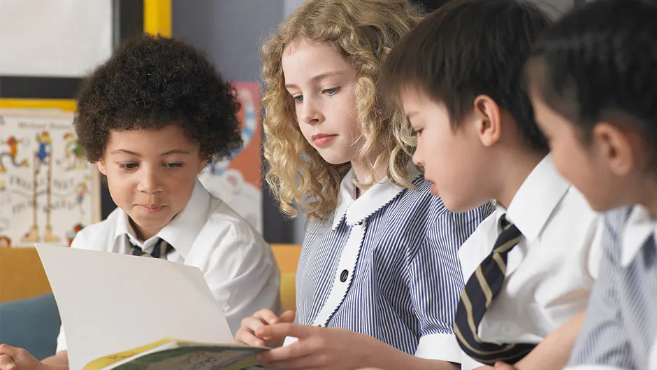 A teacher exemplifying one of the 10 essential classroom management skills as her class is focused and organised.